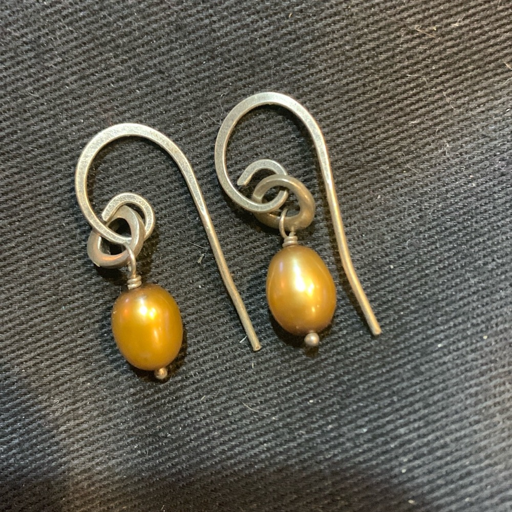 Silpada earrings. 925 silver posts with yellow/gold colored oval drop design